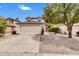 Inviting home with a two-car garage, desert landscaping, mature trees, and a well-manicured front yard at 1811 S 39Th St # 30, Mesa, AZ 85206