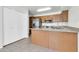 Open kitchen design with a central island, stainless steel appliances, and modern countertops at 1811 S 39Th St # 30, Mesa, AZ 85206