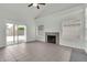Spacious living room with a fireplace, tile flooring, vaulted ceilings, and sliding glass doors at 1811 S 39Th St # 30, Mesa, AZ 85206