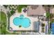Aerial view of the community pool with loungers, tables and spa at 1811 S 39Th St # 30, Mesa, AZ 85206