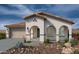 Charming single-story home featuring a tile roof, stucco finish, and a welcoming front porch at 21151 E Arrowhead Trl, Queen Creek, AZ 85142