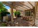 Backyard patio with lattice cover features a barbeque and outdoor dining set at 21614 N 59Th Ln, Glendale, AZ 85308