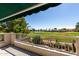 Balcony with golf course view, features a railing, tile floor and retractable awning at 21614 N 59Th Ln, Glendale, AZ 85308
