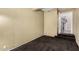 Cozy basement space with neutral walls and plush carpeting leading to an adjacent staircase at 21614 N 59Th Ln, Glendale, AZ 85308