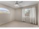 Bedroom with natural light with light walls and carpeted flooring at 21614 N 59Th Ln, Glendale, AZ 85308