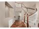 Grand foyer with a curved staircase, tile flooring, and a view into the living room at 21614 N 59Th Ln, Glendale, AZ 85308