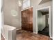Grand foyer featuring tile flooring, a statement double door entry, and an abundance of natural light at 21614 N 59Th Ln, Glendale, AZ 85308