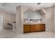 Upper hallway featuring built-in cabinets and open display shelving at 21614 N 59Th Ln, Glendale, AZ 85308