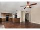 Open-concept space featuring a kitchen with stainless appliances and a spacious seating area at 21614 N 59Th Ln, Glendale, AZ 85308