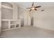 Cozy living room with a fireplace feature, neutral walls and plush carpeting at 21614 N 59Th Ln, Glendale, AZ 85308
