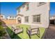 Beautiful backyard featuring plush green artificial turf, patio, and an outdoor seating area at 2195 N Peden Dr, Chandler, AZ 85225