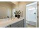 Bathroom featuring a vanity, mirror, and access to the shower at 2195 N Peden Dr, Chandler, AZ 85225