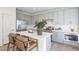 Modern kitchen with stainless steel appliances, gray cabinets, quartz countertops and center island seating at 2195 N Peden Dr, Chandler, AZ 85225
