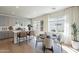 Bright, open-concept kitchen features an island with seating, gray cabinets and stainless-steel appliances at 2195 N Peden Dr, Chandler, AZ 85225