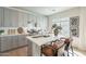 Modern kitchen with gray cabinets, quartz countertops, stainless steel appliances and island with seating at 2195 N Peden Dr, Chandler, AZ 85225