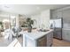 Modern kitchen with stainless steel appliances, quartz countertops and an island with barstool seating at 2195 N Peden Dr, Chandler, AZ 85225
