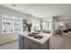Open-concept kitchen with stainless steel appliances, a center island with barstool seating and bright lighting at 2195 N Peden Dr, Chandler, AZ 85225