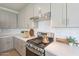 Well-equipped kitchen with stainless steel appliances, quartz countertops and subway tile backsplash at 2195 N Peden Dr, Chandler, AZ 85225