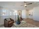 Bright and airy loft area featuring a ceiling fan, hardwood floors and white paint throughout at 2195 N Peden Dr, Chandler, AZ 85225