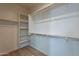 Spacious walk-in closet featuring custom shelving and ample storage space for organization at 2195 N Peden Dr, Chandler, AZ 85225