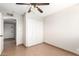 Comfortable bedroom with tile flooring, closet space, and convenient access to the hallway at 2242 W Pecan Rd, Phoenix, AZ 85041