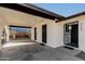 Attached carport providing shaded parking, access to backyard and secure gate at 2242 W Pecan Rd, Phoenix, AZ 85041