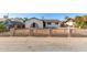 Charming single-story home featuring a secure fence and a well-maintained front yard at 2242 W Pecan Rd, Phoenix, AZ 85041