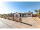 Well-maintained home featuring a secure fence and spacious driveway at 2242 W Pecan Rd, Phoenix, AZ 85041