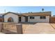 Charming home featuring a secure fence and spacious driveway at 2242 W Pecan Rd, Phoenix, AZ 85041