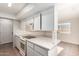 Well-lit kitchen with white cabinets, sleek countertops, and essential appliances for meal preparation at 2242 W Pecan Rd, Phoenix, AZ 85041