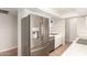 Stainless steel refrigerator and sink in the kitchen with white brick wall at 2242 W Pecan Rd, Phoenix, AZ 85041