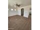 Inviting bedroom with cozy carpeting, ceiling fan and abundant natural light from the large window at 22872 W Gardenia Dr, Buckeye, AZ 85326