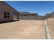 Picture of a home's backyard with block wall and dirt ground at 24486 W Grenadine Rd, Buckeye, AZ 85326
