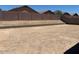 Picture of a home's backyard with block wall and dirt ground at 24486 W Grenadine Rd, Buckeye, AZ 85326