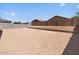 New construction backyard ready for landscaping and personalization, with block wall fencing and potential at 24486 W Grenadine Rd, Buckeye, AZ 85326