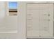 Bathroom showcasing tiled walk-in shower and soaking tub by the window at 24486 W Grenadine Rd, Buckeye, AZ 85326