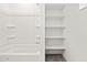 Picture of a shower/tub and a shelving unit in the bathroom at 24486 W Grenadine Rd, Buckeye, AZ 85326