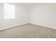 Bedroom featuring carpeted floors and a bright window at 24486 W Grenadine Rd, Buckeye, AZ 85326