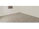 A cozy bedroom with plush carpeting and neutral walls at 24486 W Grenadine Rd, Buckeye, AZ 85326
