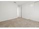 Bedroom featuring carpeted floors and closet with sliding doors at 24486 W Grenadine Rd, Buckeye, AZ 85326