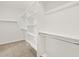 Walk-in closet featuring neutral carpet, shelving and clothing rods at 24486 W Grenadine Rd, Buckeye, AZ 85326