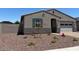 Charming single story home featuring a low maintenance rock yard, attached two car garage, and covered entryway at 24486 W Grenadine Rd, Buckeye, AZ 85326