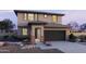 Charming two-story home with brick accents, landscaped front yard and two-car garage at 25130 N 156Th Ln, Surprise, AZ 85387