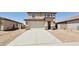 Charming two-story home with a wide driveway and a two-car garage in a residential neighborhood at 25130 N 156Th Ln, Surprise, AZ 85387