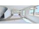 Bright, open-concept living space showcasing tile flooring and a kitchen with a center island at 25130 N 156Th Ln, Surprise, AZ 85387