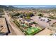 Sprawling desert property featuring a pool, a tennis court, desert landscaping, and views of the city at 2731 W Desert Ranch Rd, Phoenix, AZ 85086