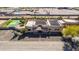 Exterior shot of a home with a sport court, desert landscaping, block fence and lush desert vegetation at 2731 W Desert Ranch Rd, Phoenix, AZ 85086