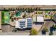 Aerial view of the property showcasing a pool, hot tub, putting green, basketball court, and solar panels at 2731 W Desert Ranch Rd, Phoenix, AZ 85086
