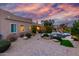 Backyard features lush landscaping, patio furniture, and desert sunset at 2731 W Desert Ranch Rd, Phoenix, AZ 85086