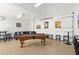 Spacious basement game room with a pool table, comfortable seating, and custom décor at 2731 W Desert Ranch Rd, Phoenix, AZ 85086